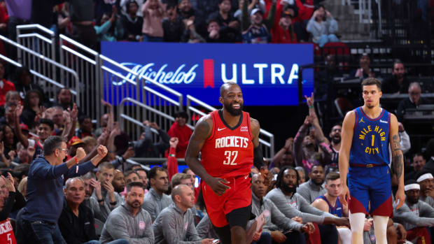 Rockets forward Jeff Green (32) reacts to his three-point basket against Denver Nuggets forward Michael Porter Jr. (1) in the second half at Toyota Center.